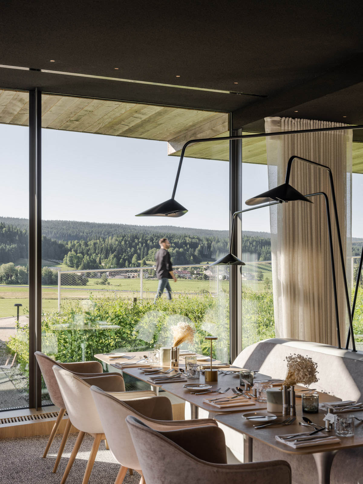 BIG reveals hotel with zigzagging slabs for watchmaker brand Audemars Piguet in Le Brassus