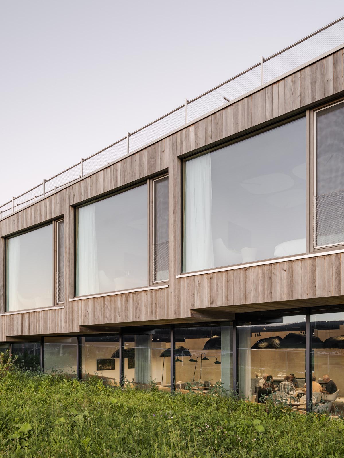 BIG reveals hotel with zigzagging slabs for watchmaker brand Audemars Piguet in Le Brassus