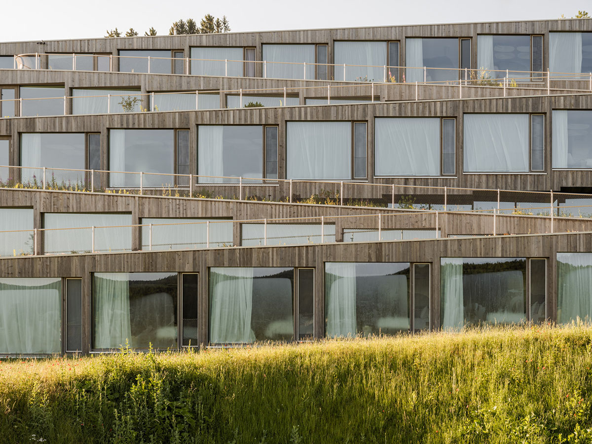 BIG reveals hotel with zigzagging slabs for watchmaker brand Audemars Piguet in Le Brassus