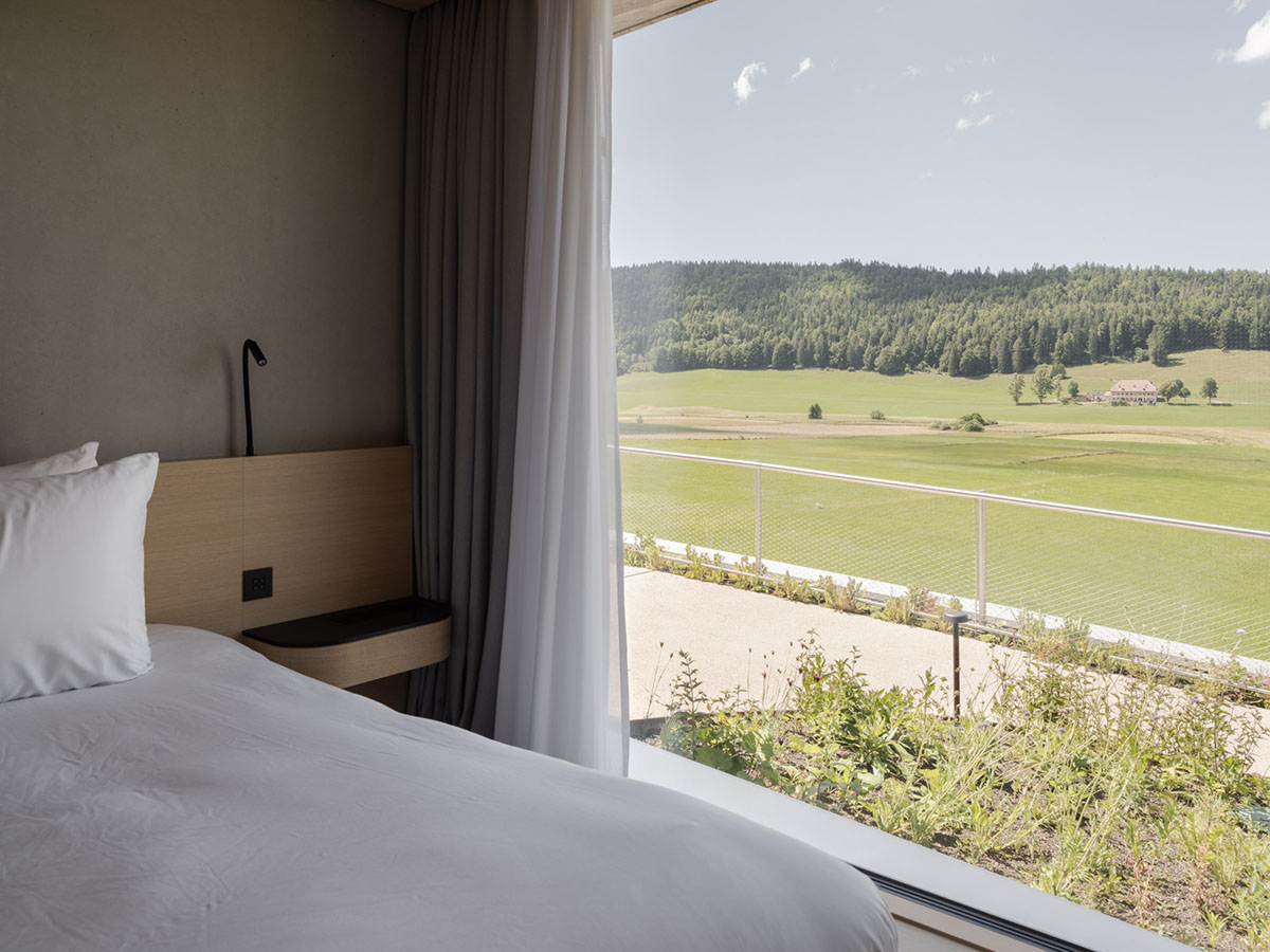 BIG reveals hotel with zigzagging slabs for watchmaker brand Audemars Piguet in Le Brassus