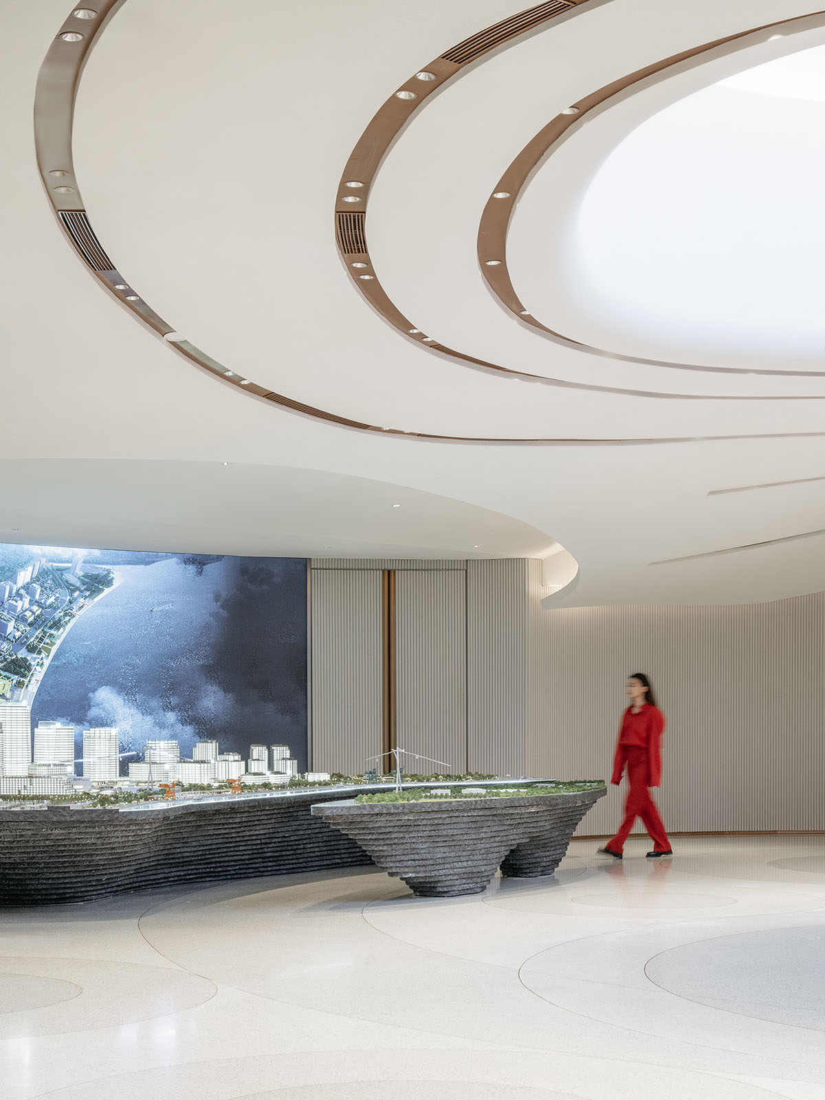 Undulating lines and expansive waves define interior of Orbit public exhibition hall in Shanghai 