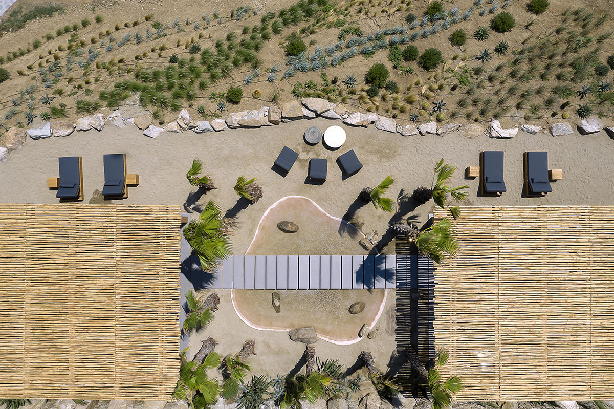 MK Design Studio designs luxurious holiday villa with creamy white walls and stone-walled terraces