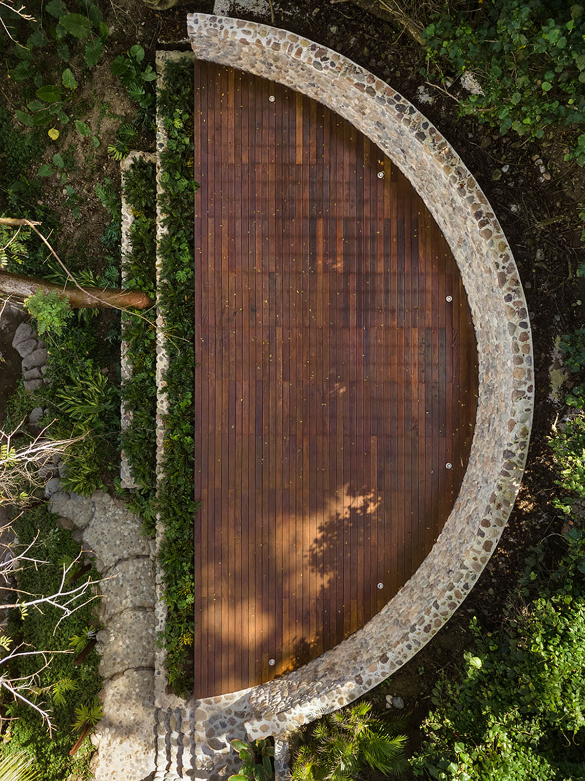 MAIN OFFICE adds half-circle yoga platform to thatched-roof guest villas in Sayulita, Mexico