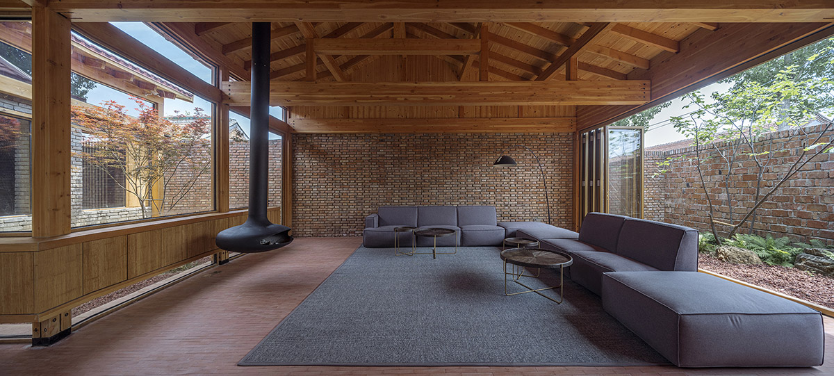 Archstudio renovates Beijing's old courtyard house with new wooden additions 