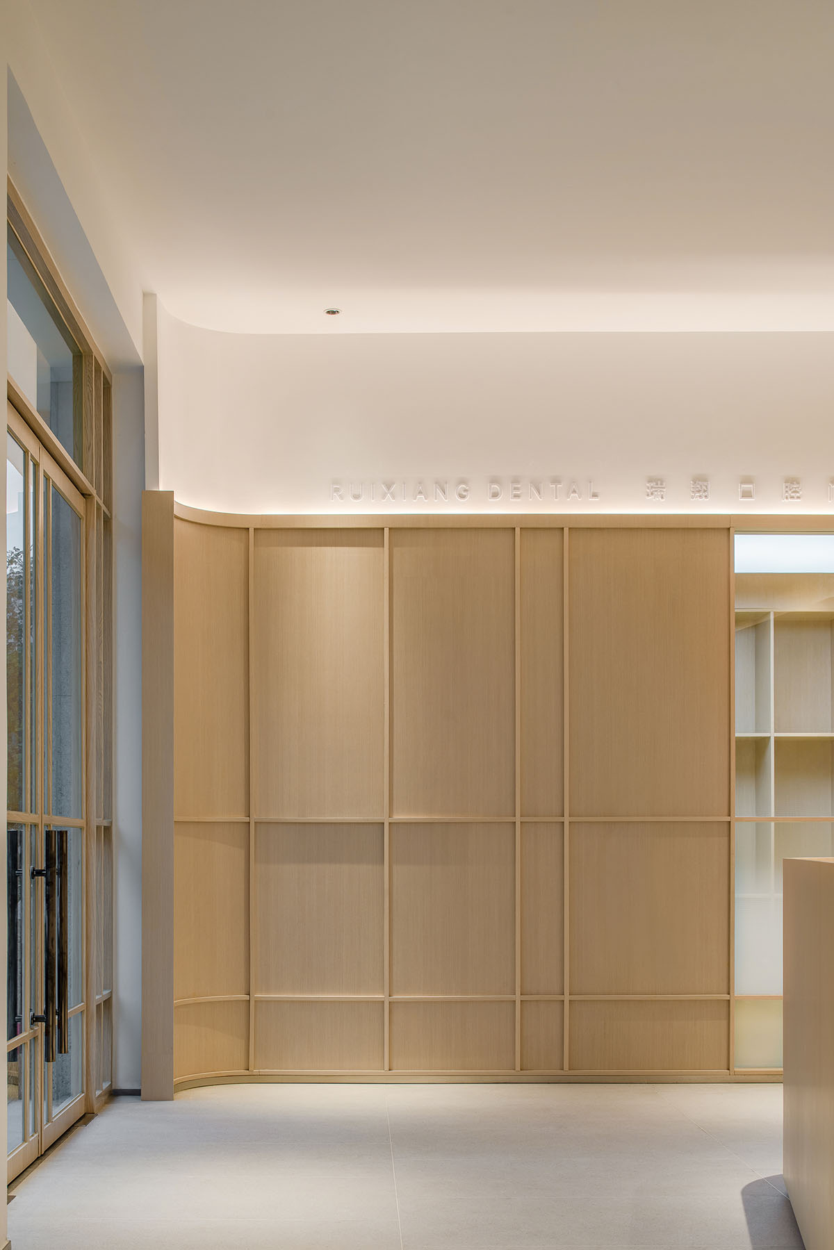 JACKY.W DESIGN completes dental clinic with rounded wooden walls and natural tones in China 