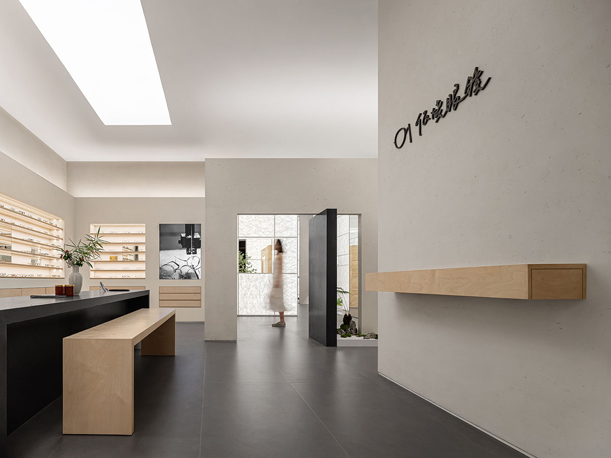 Luminous screen walls create fluid interiors for an optic store designed by Onexn Architects 