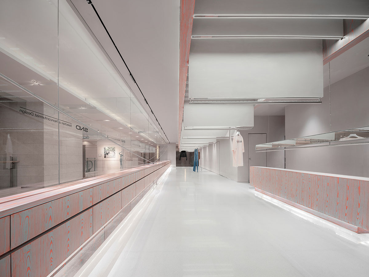 Various Associates creates show-like and pink-hued fashion store under a viaduct in Chongqing