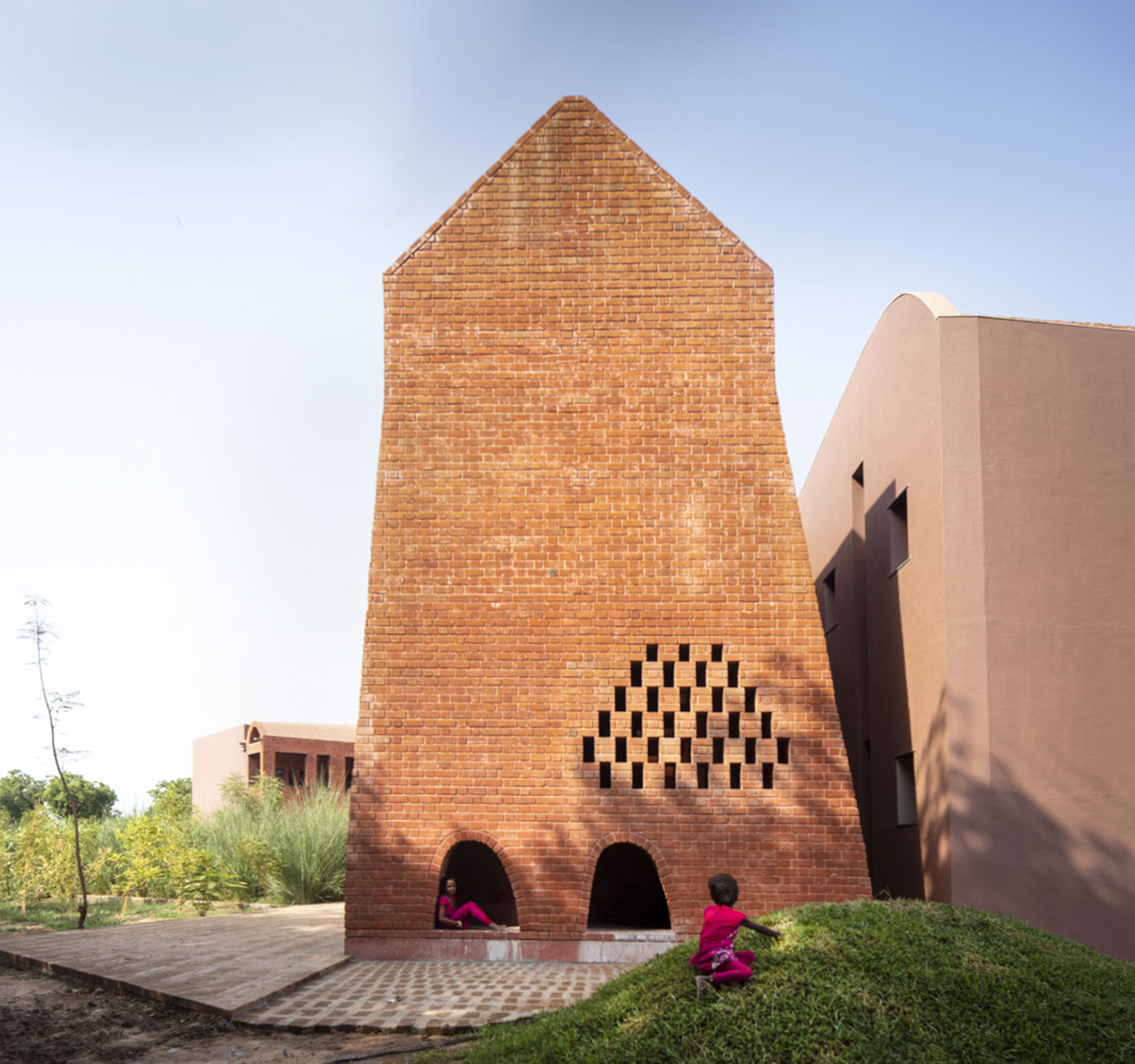 A school built from tilted brick vaults evoke a child's freedom in India