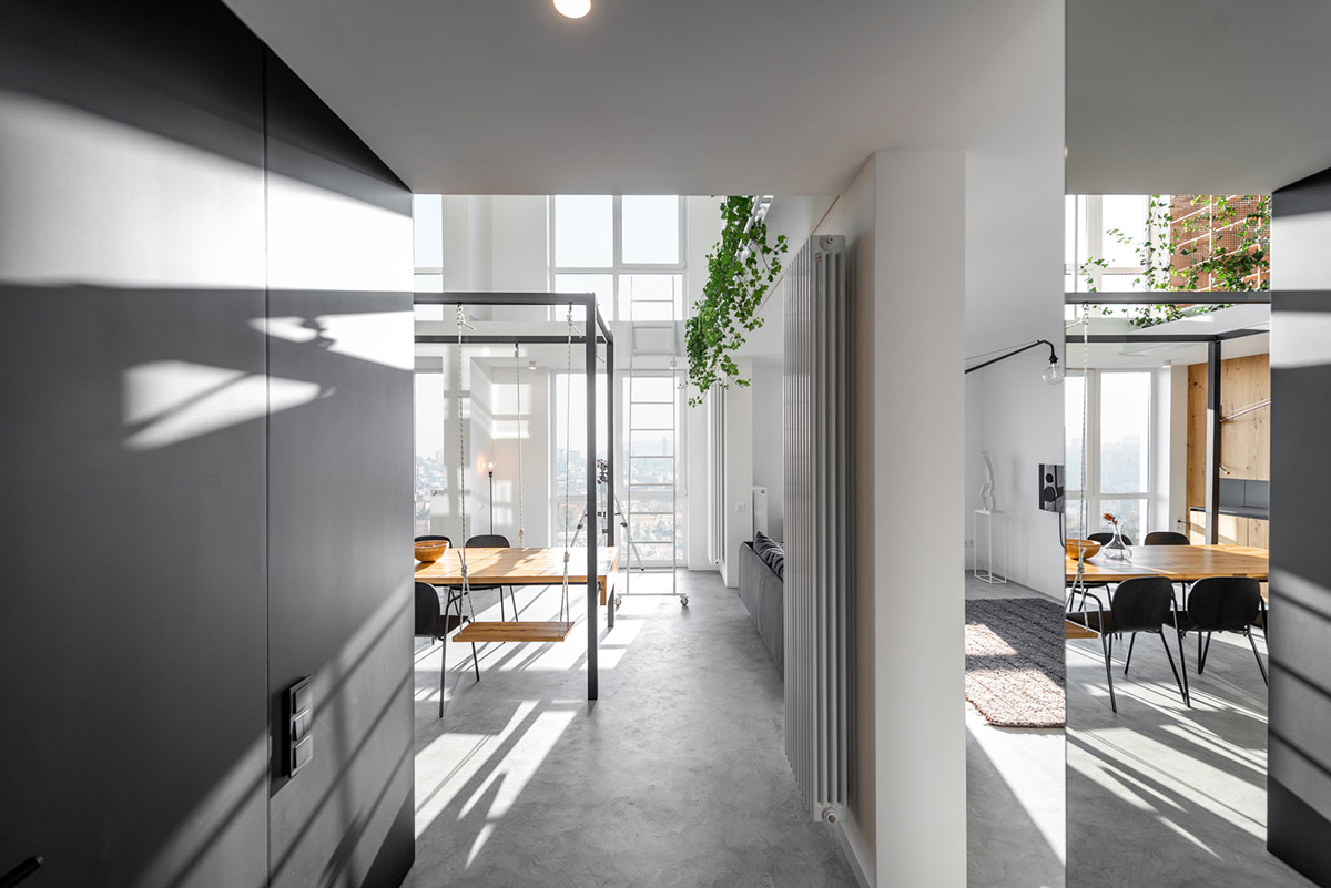 Metal framed-table, glass partitions, green infills make this interior space vivid and light in Lviv