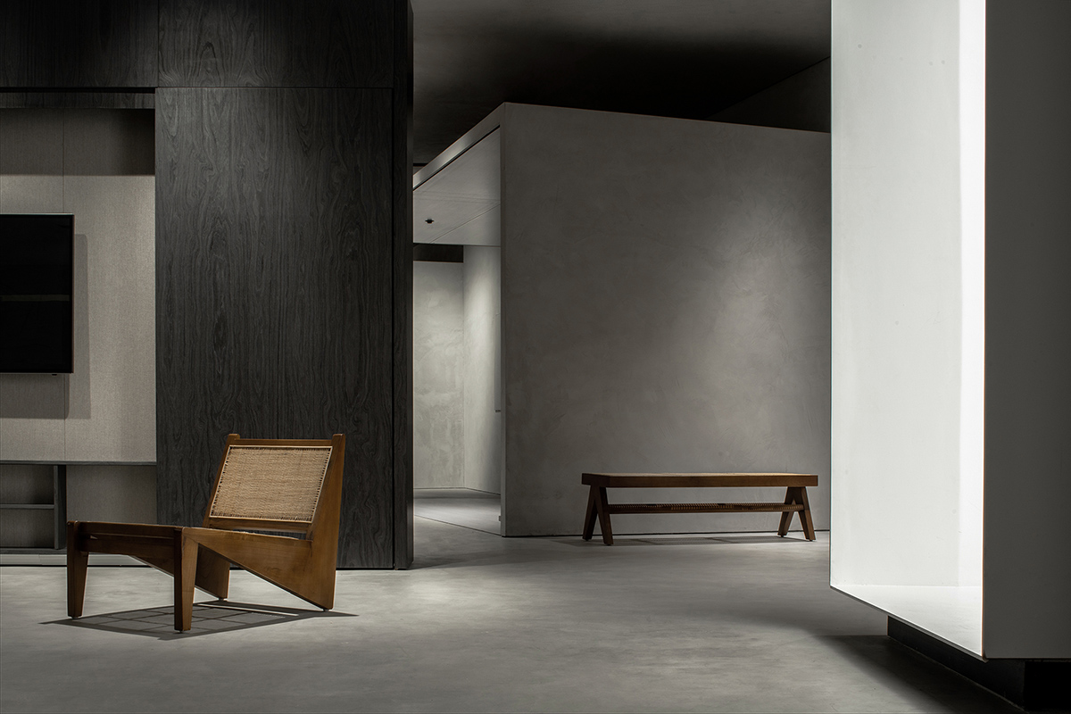 JST ARCHITECTURE creates dark-colored palette by adding a geometrical aesthetic to this showroom