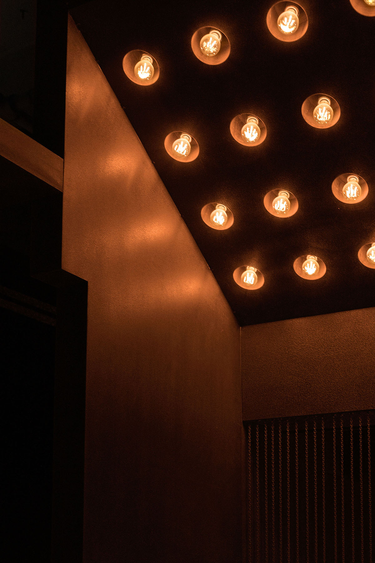 All Design Studio uses bold elements and soft lighting to create Lieben Bar in Shanghai