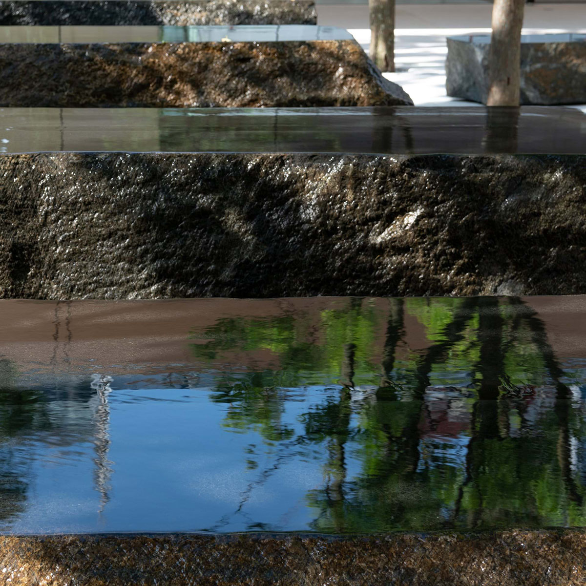 Foster + Partners completes new Apple store with public plaza and water sculptures in Taipei