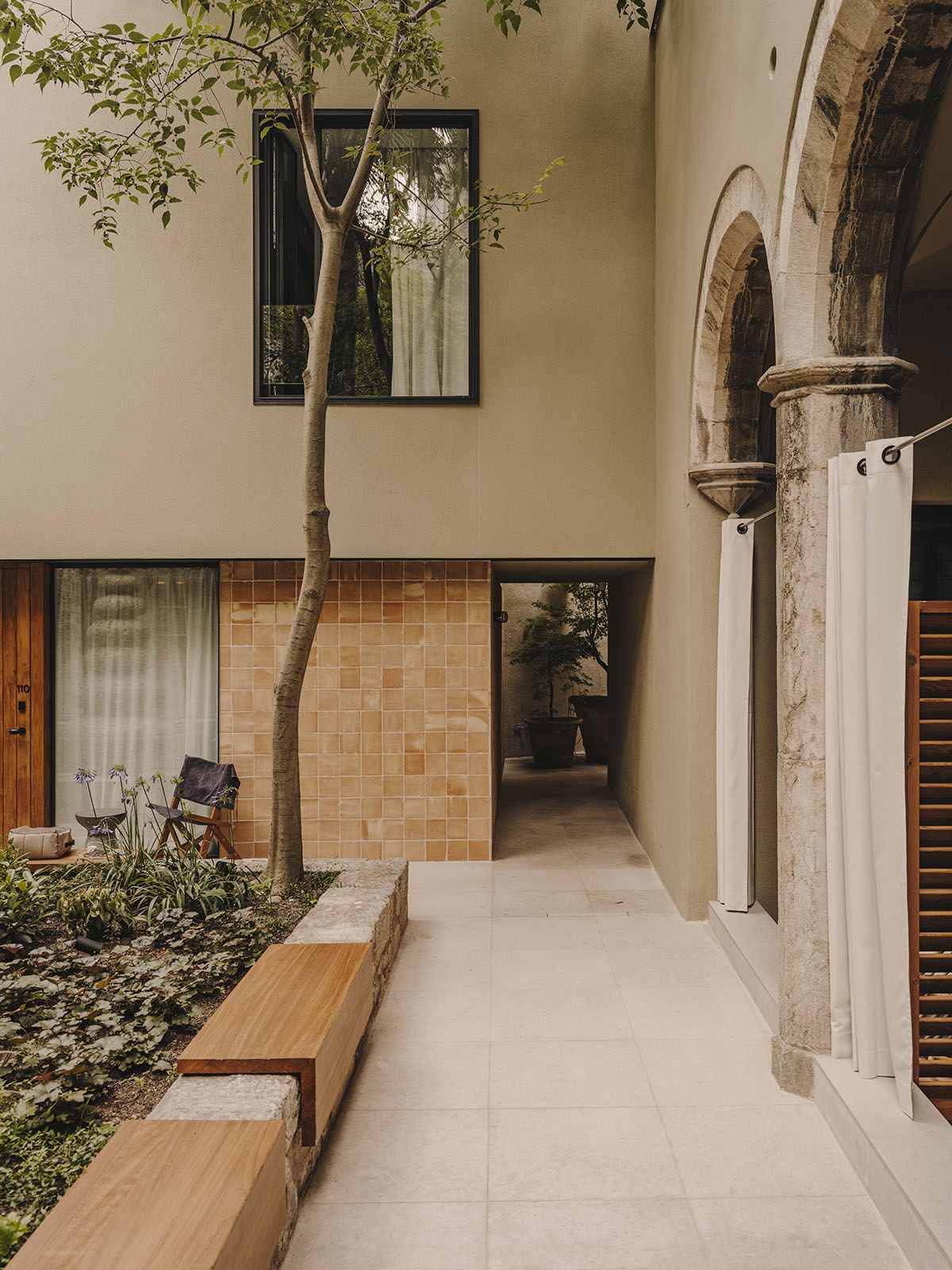 El Equipo Creativo converts 18th-century palace into hotel with rich textures and colors in Girona