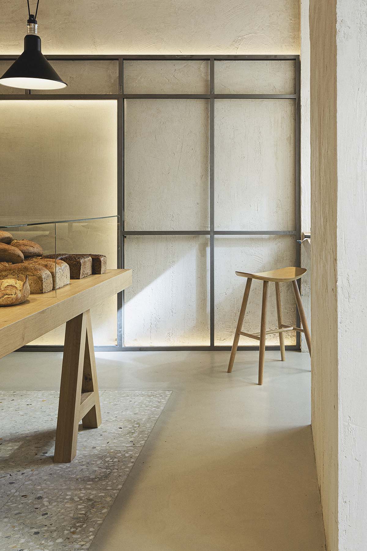 Bakery features central oak tables that revive the traditional dining room experience 