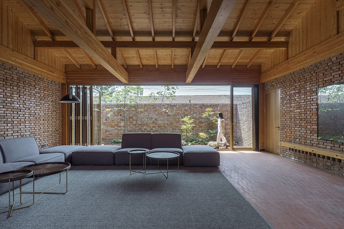 Archstudio renovates Beijing's old courtyard house with new wooden additions 