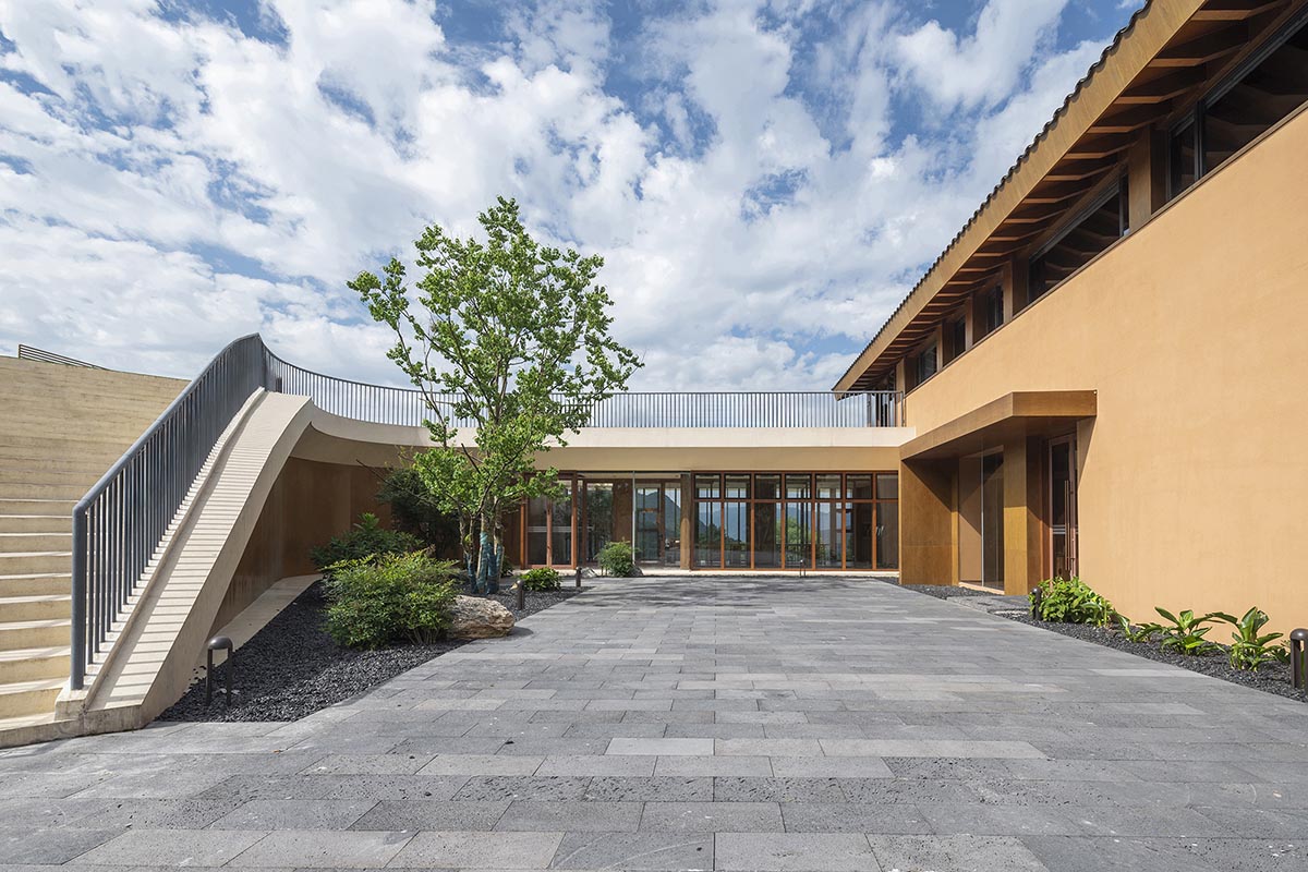 Archstudio built bridge-like exhibition center featuring flowing auditorium in Hubei Province