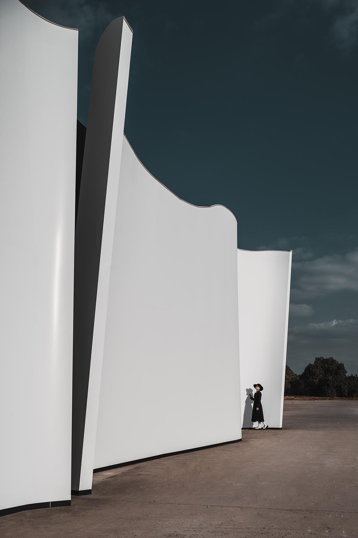 Chinese chapel creates a fluid silhouette featuring curving walls to mimic blossoming petals 