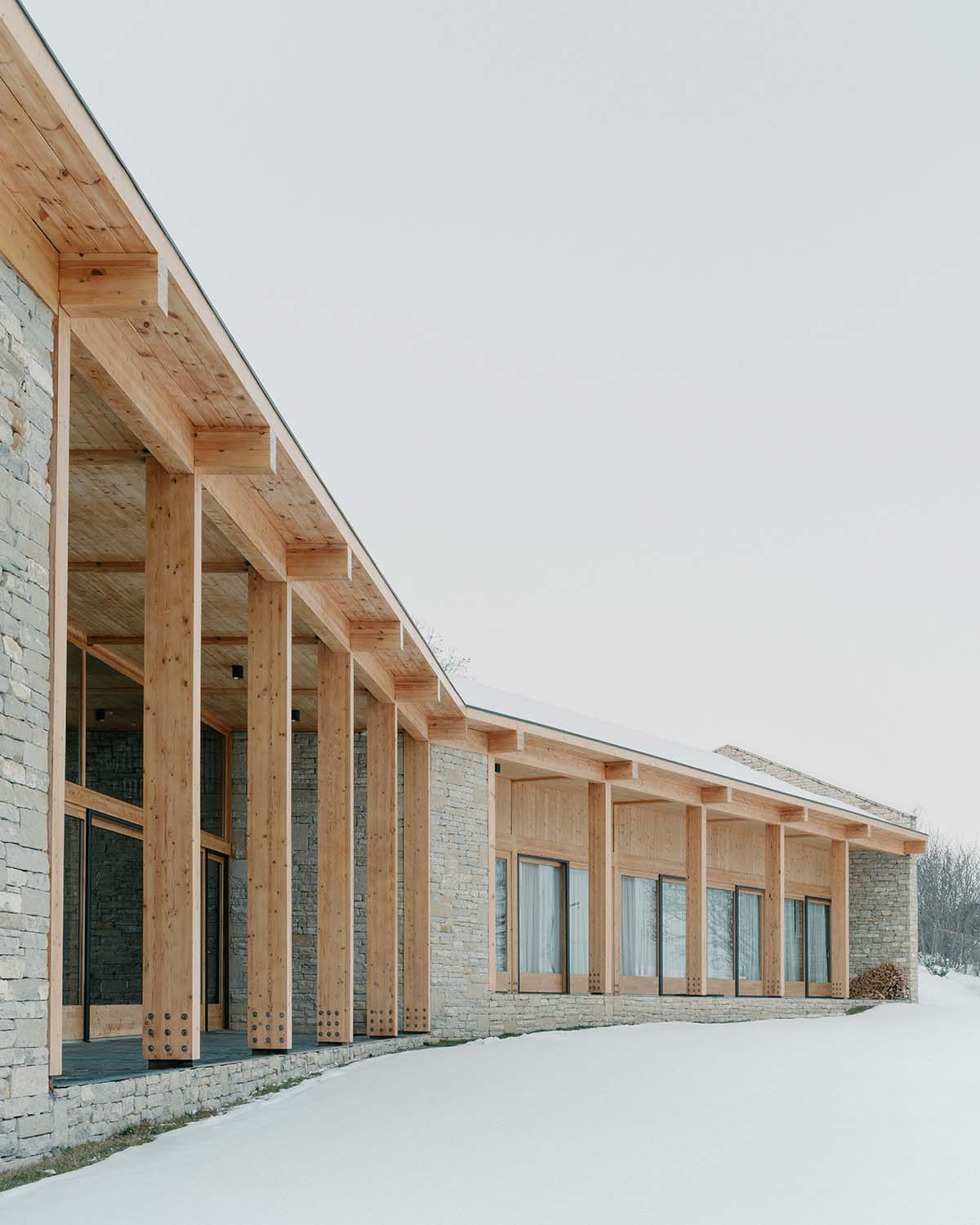 The stone and wood Tbilisi residence integrates architecture with the natural landscape