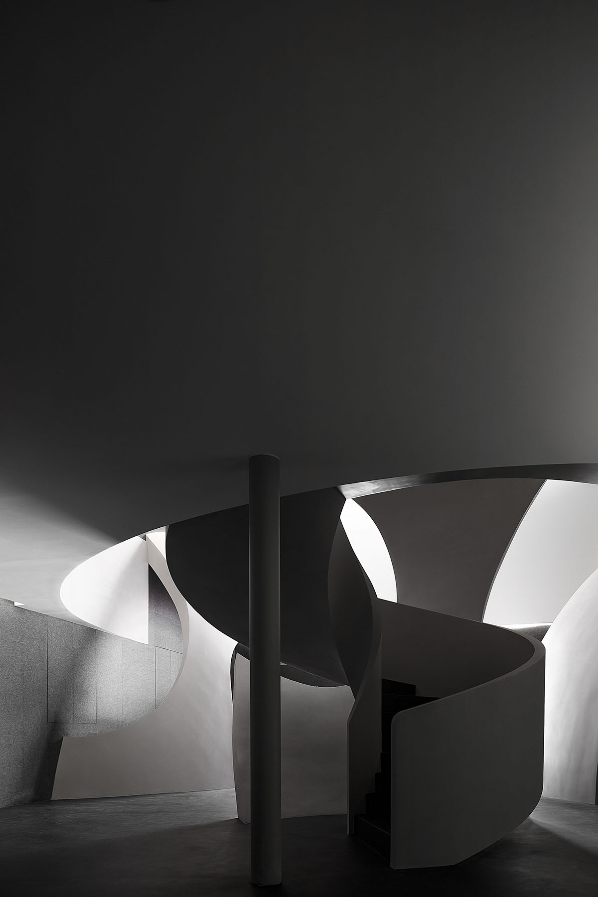 A beauty salon by AD ARCHITECTURE features dark-hued interiors drawing inspiration from cells