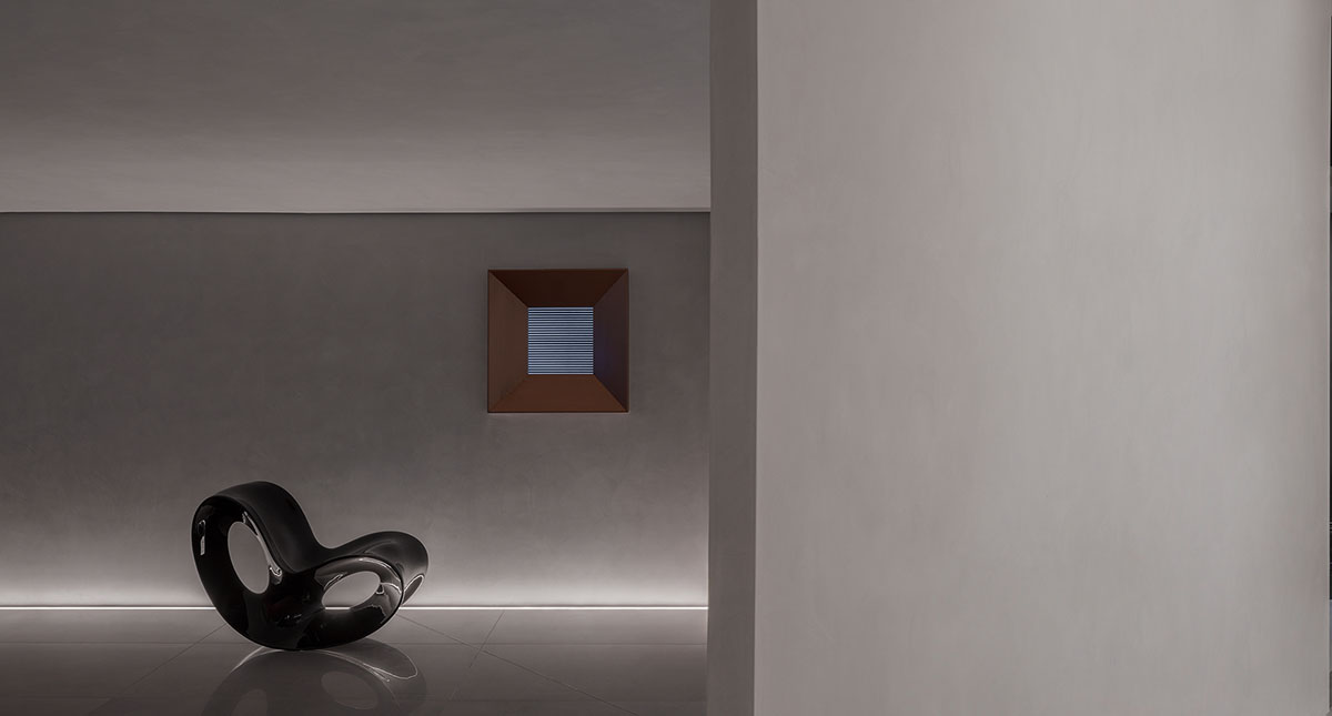 Masanori Designs' interiors include red cylinder bringing rainwater into the space