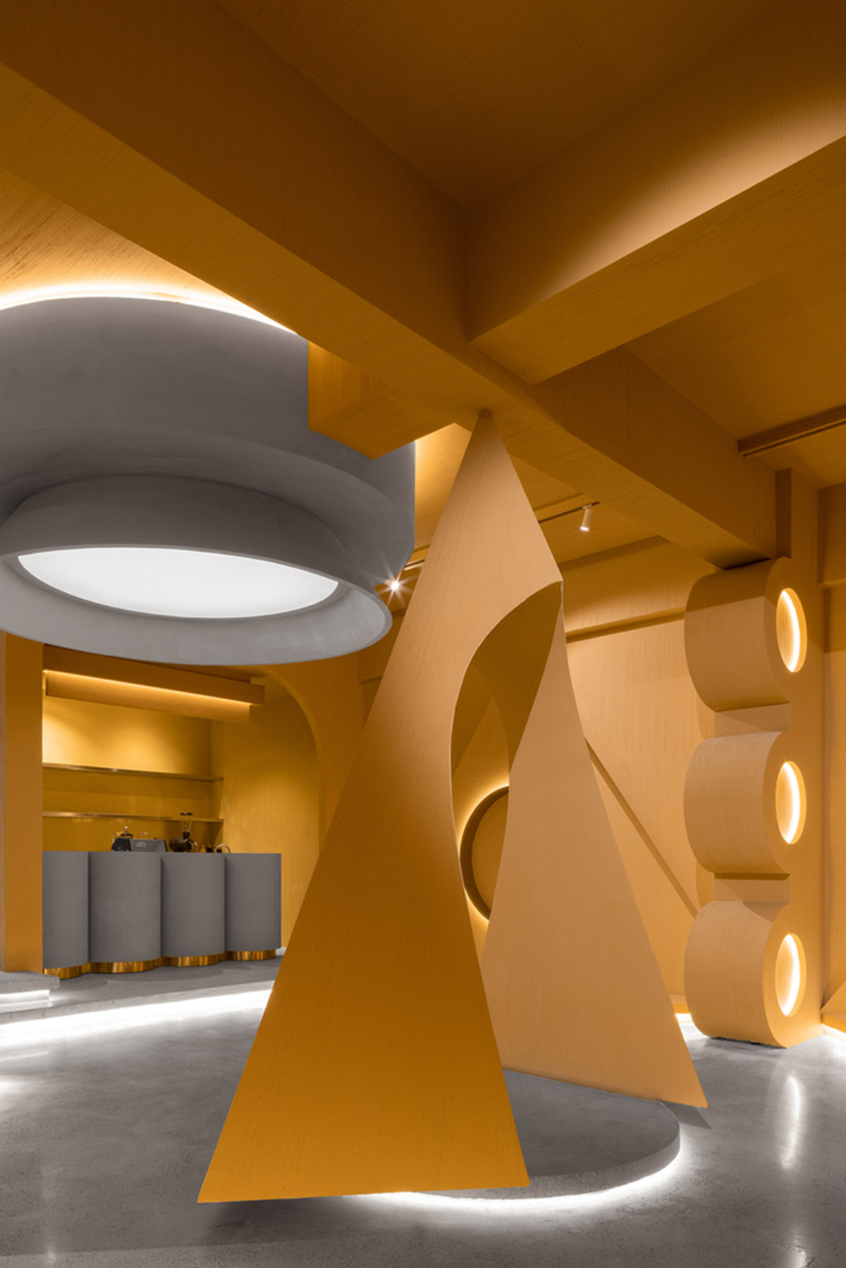 Angular corrugated stainless steel sheets form this showroom designed by PIG DESIGN in Hangzhou