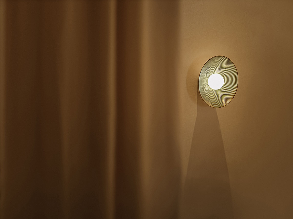 Tea house interiors wrapped by earth-toned fabric curtains act like 