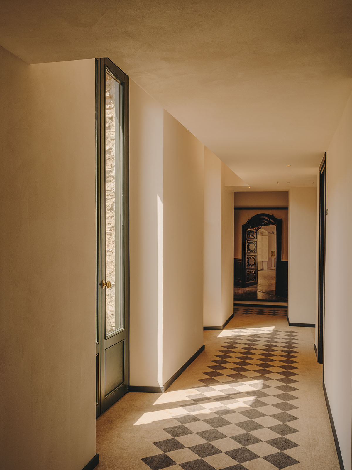 El Equipo Creativo converts 18th-century palace into hotel with rich textures and colors in Girona