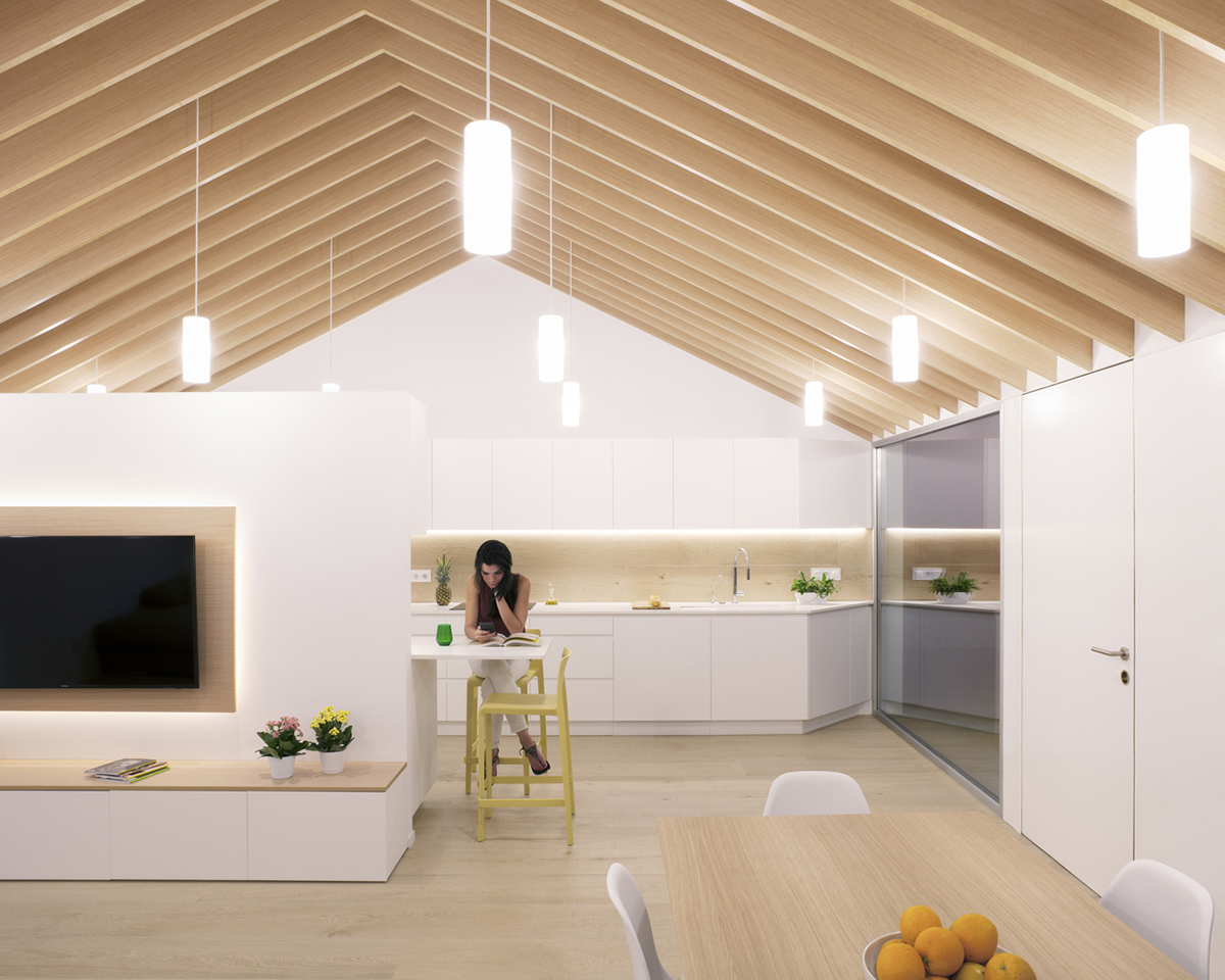 Pablo Muñoz Payá Arquitectos renovates former house with wooden shutters in Spain