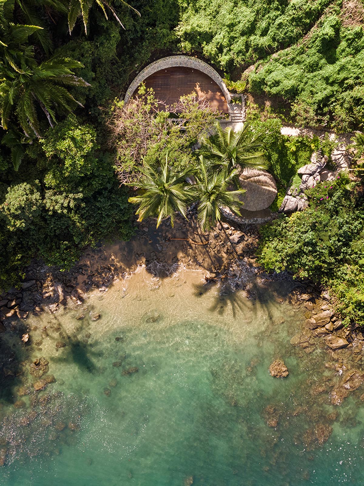 MAIN OFFICE adds half-circle yoga platform to thatched-roof guest villas in Sayulita, Mexico