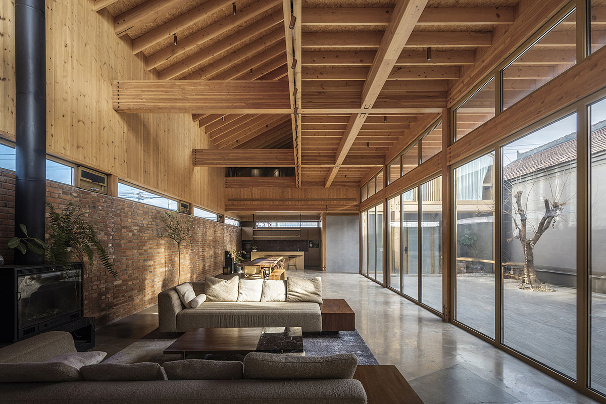 Archstudio renovates traditional Beijing courtyard house with interwoven wooden framework