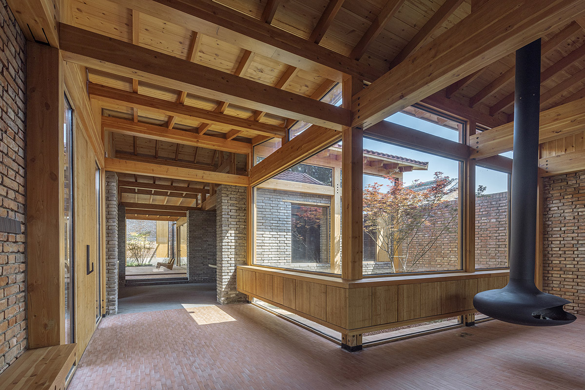 Archstudio renovates Beijing's old courtyard house with new wooden additions 