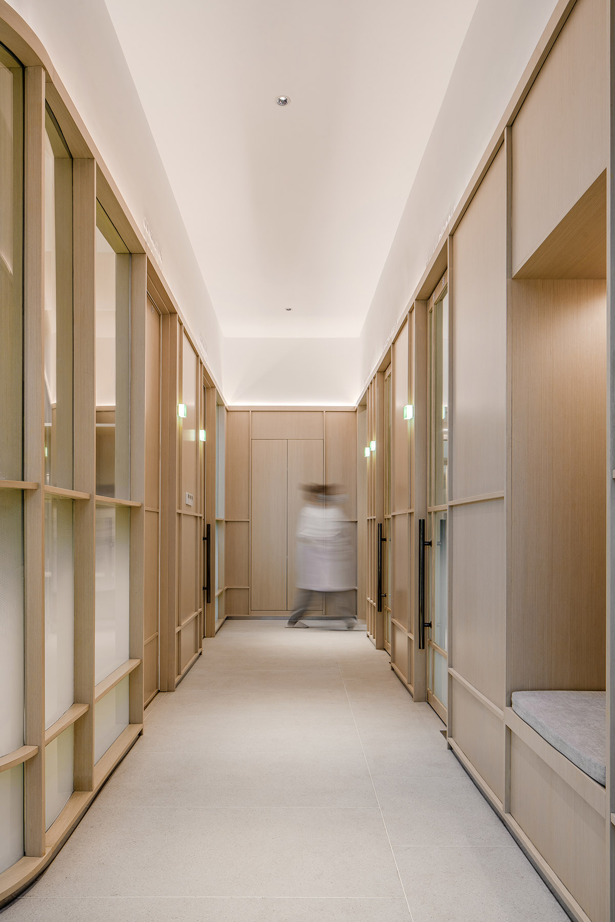JACKY.W DESIGN completes dental clinic with rounded wooden walls and natural tones in China 
