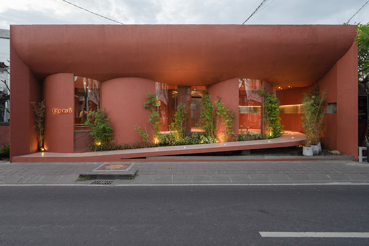 Arti Design Studio creates red arched walls to provide different seating experience in Indonesia 