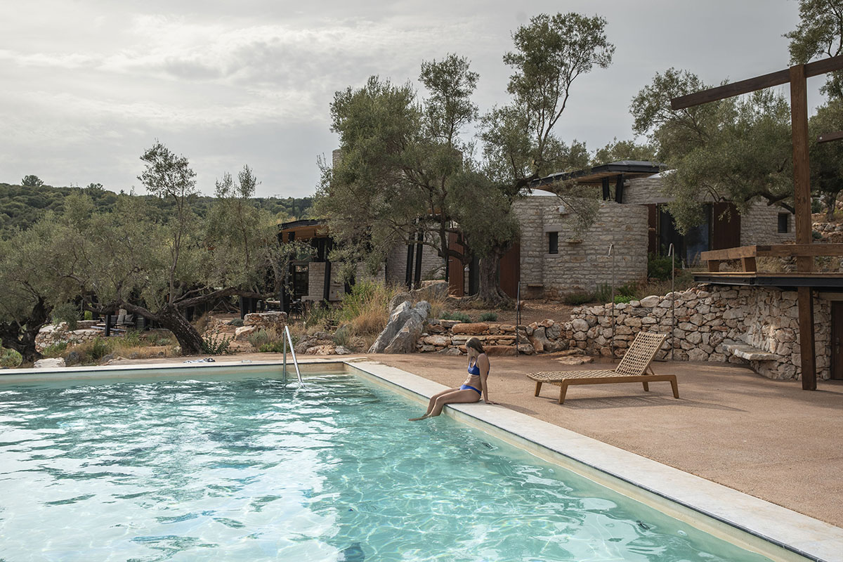 Pastoral round stone dwellings inform Meganisi House by Hiboux Architecture on Meganisi island