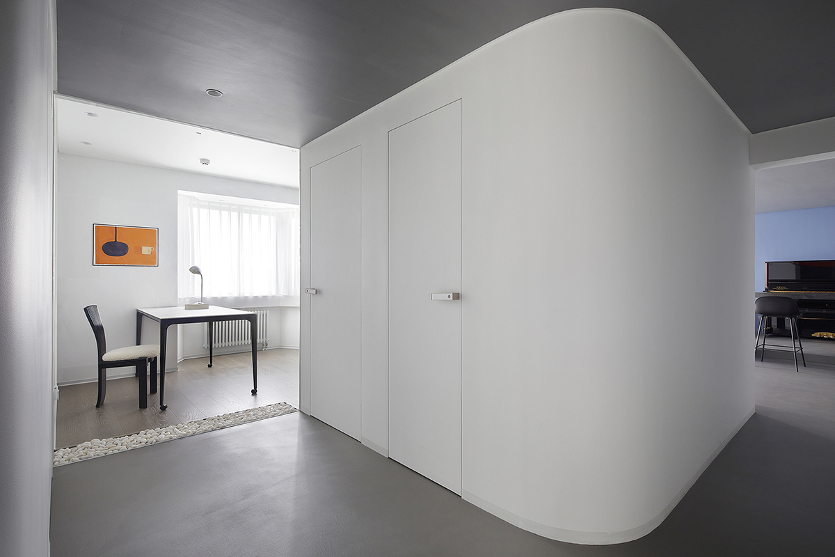 XIGO STUDIO creates gray and blue-colored interiors for apartment in Beijing 