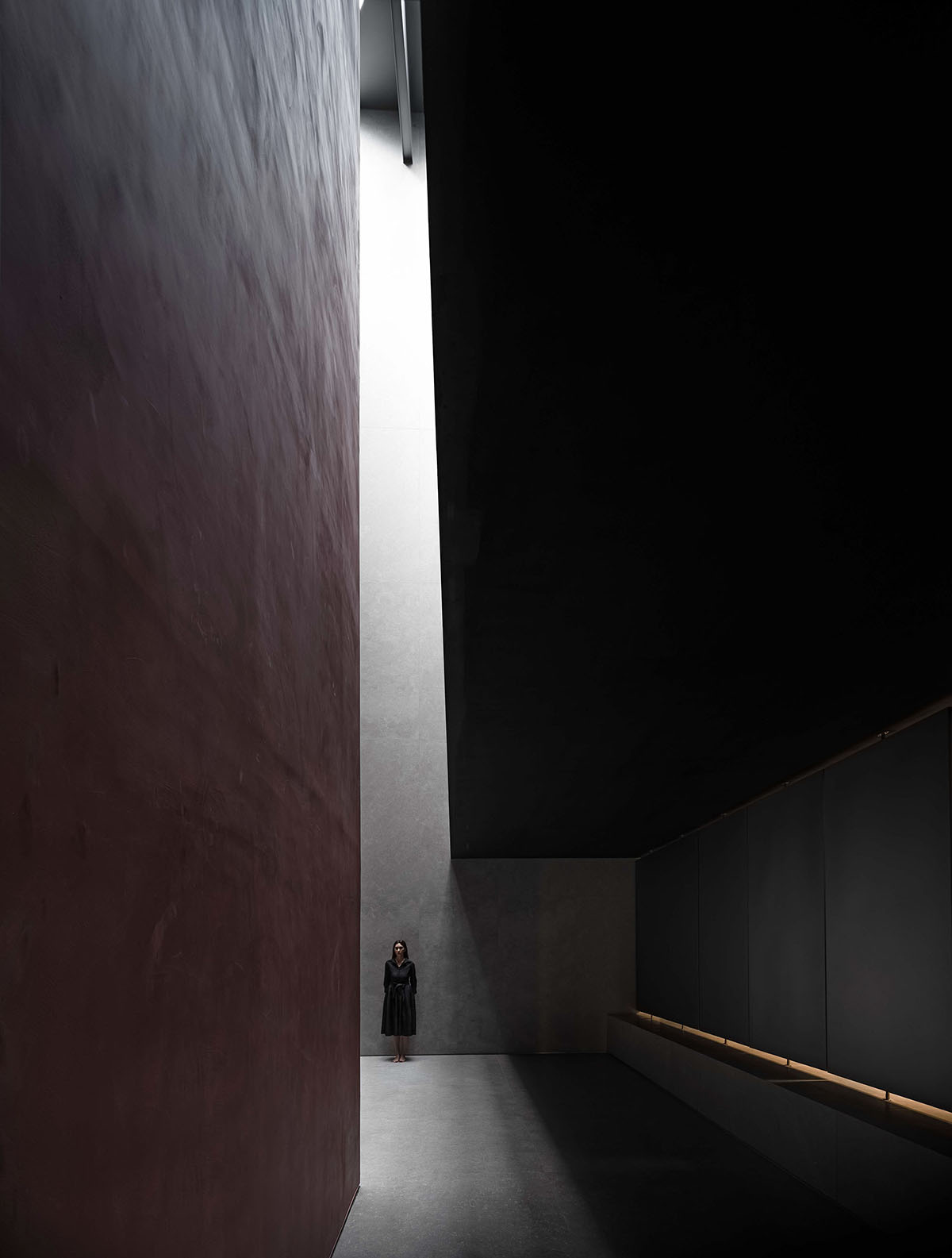 AD ARCHITECTURE creates dark interiors for showroom playing with light and sharp geometries in Foshan