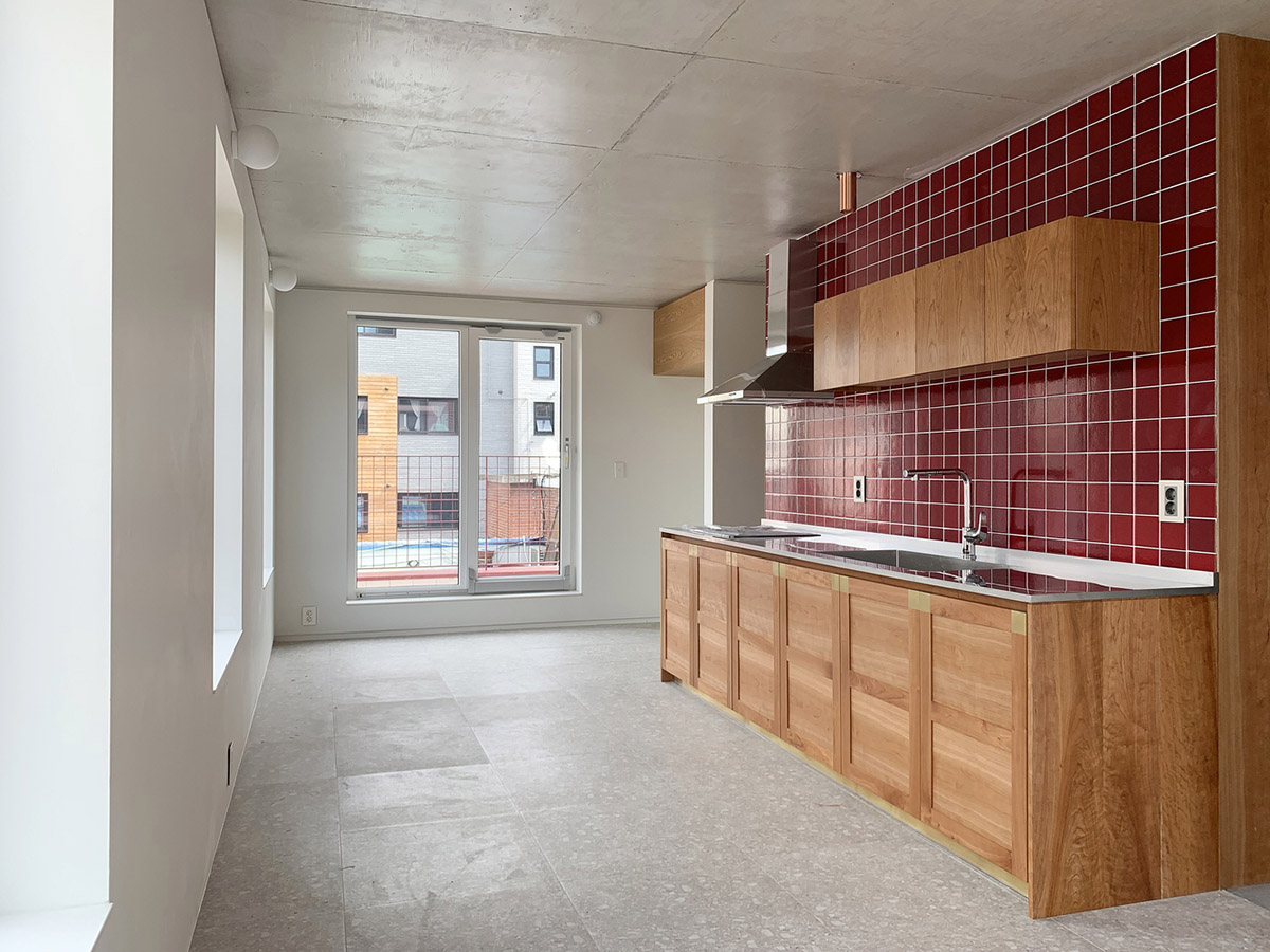 aoa architects uses red marble tiles to clad this apartment in South Korean neighborhood