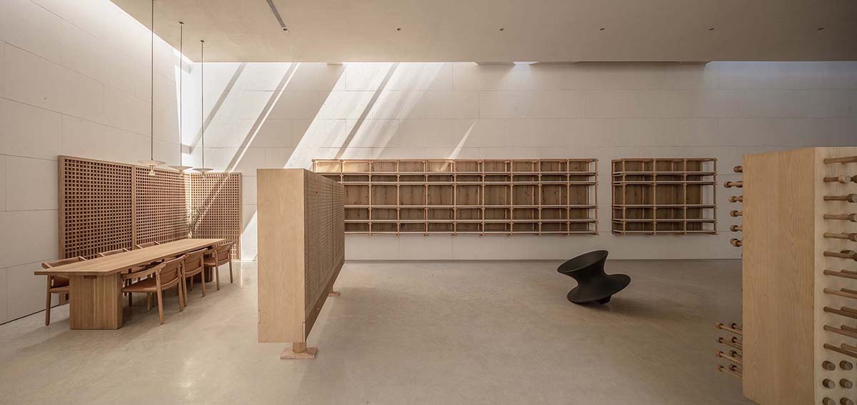 Waterfrom Design creates peaceful interior with wooden furnitures for tea community center in China