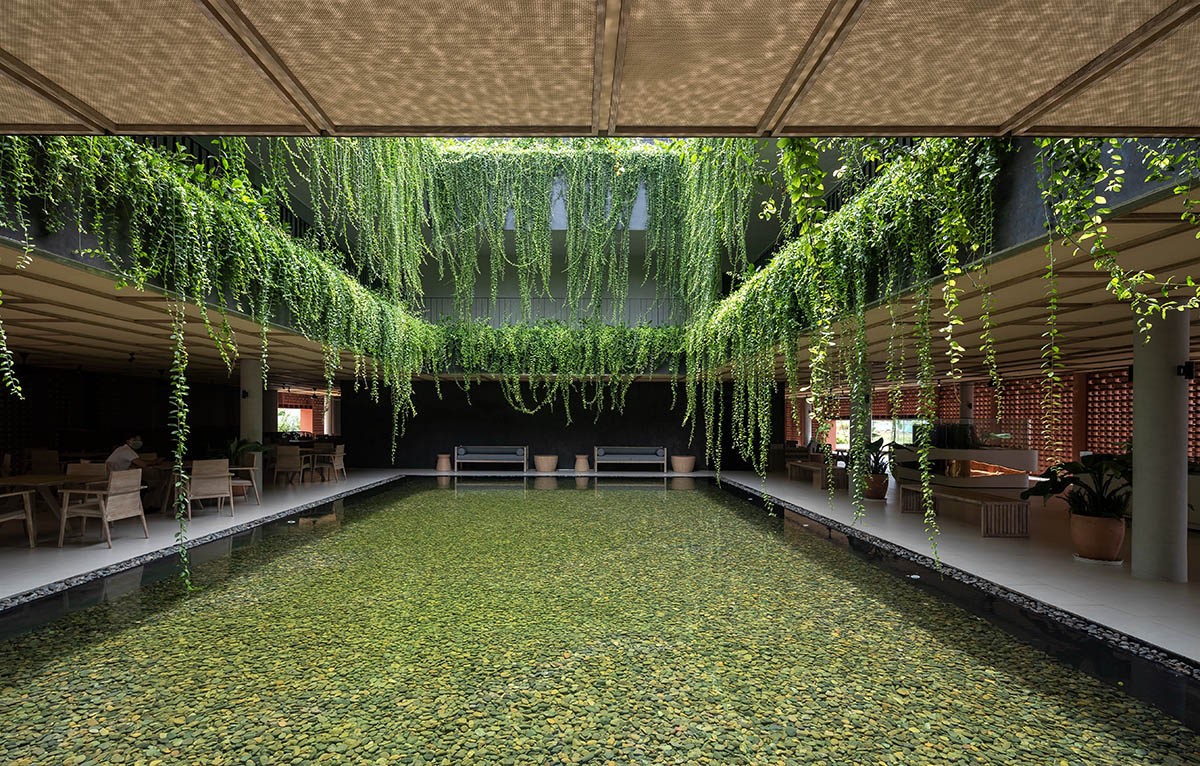 Wyndham Clubhouse by MIA Design Studio is built from bare brick layers to look like a lantern 