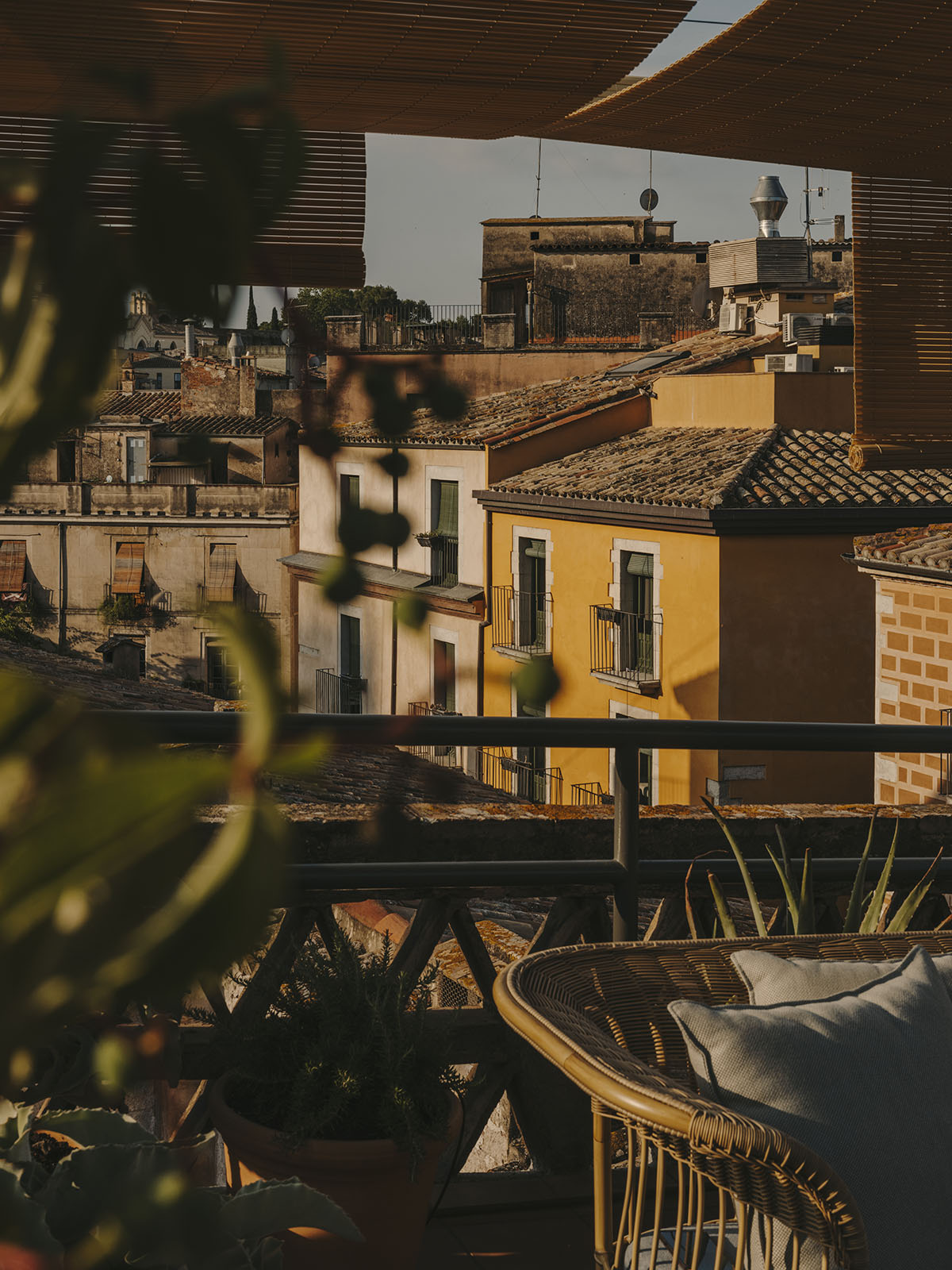 El Equipo Creativo converts 18th-century palace into hotel with rich textures and colors in Girona