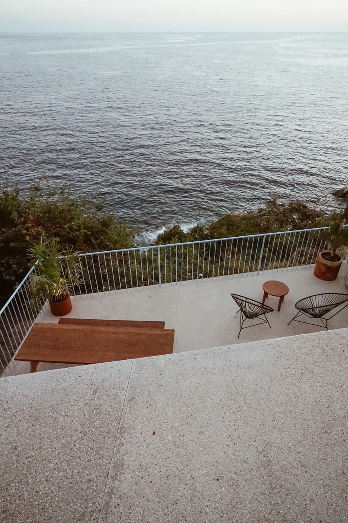 Francisco Pardo Arquitecto's housing features circular  pool overlooking the coastal landscape