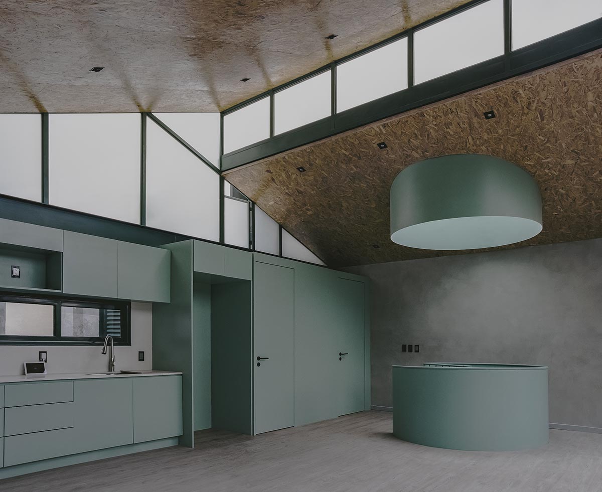AMASA Estudio renovates 1940s house with green tones and central skylight in Mexico