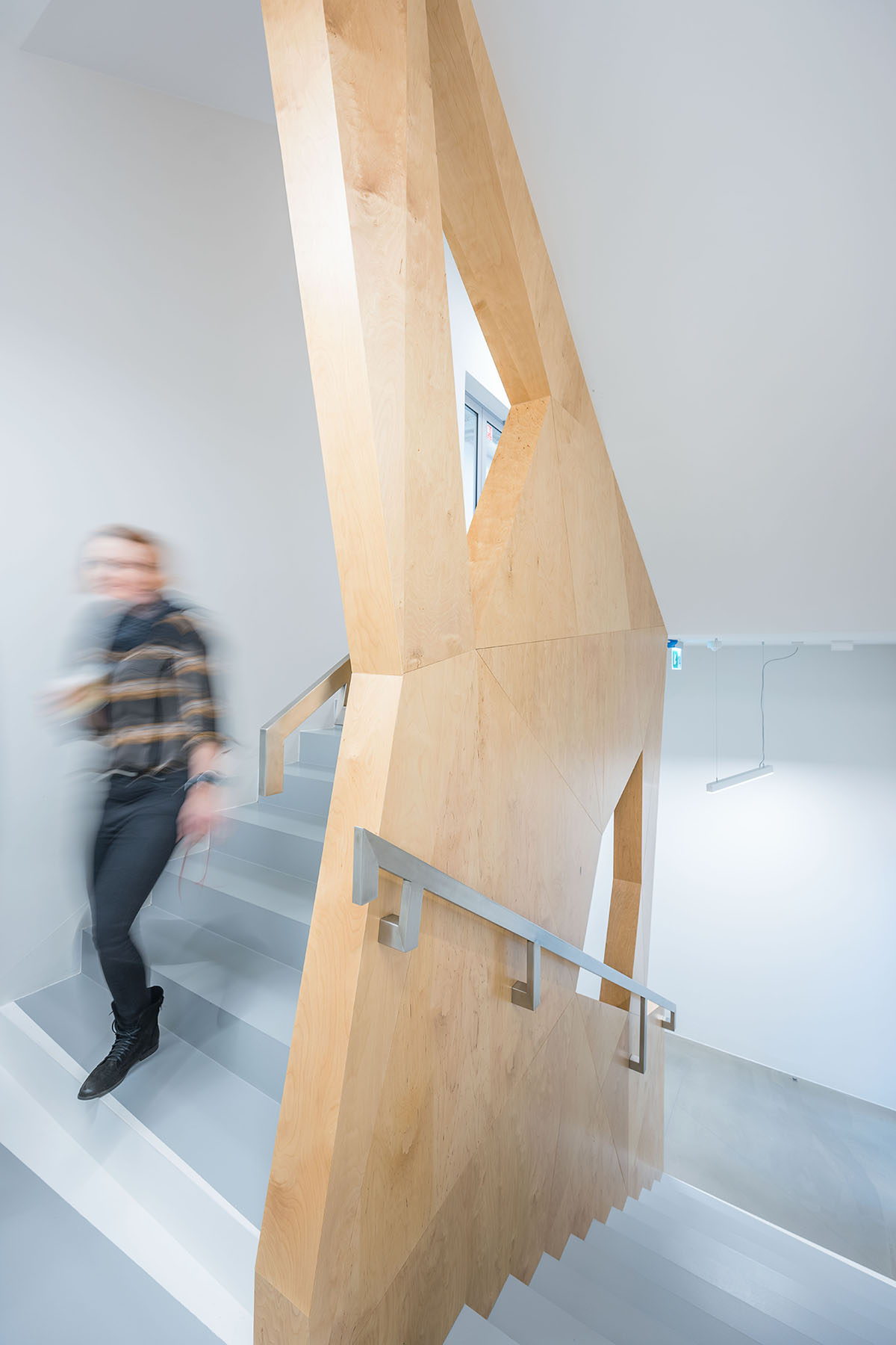 FAAB wraps research center with white perforated facade evoking sea waves in Poland 