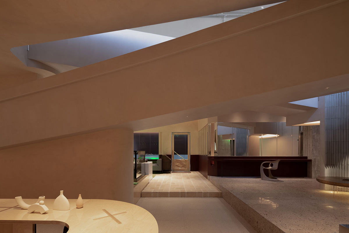 lialawlab converts old industrial building into a gallery space with 33-meter-long turned ramp