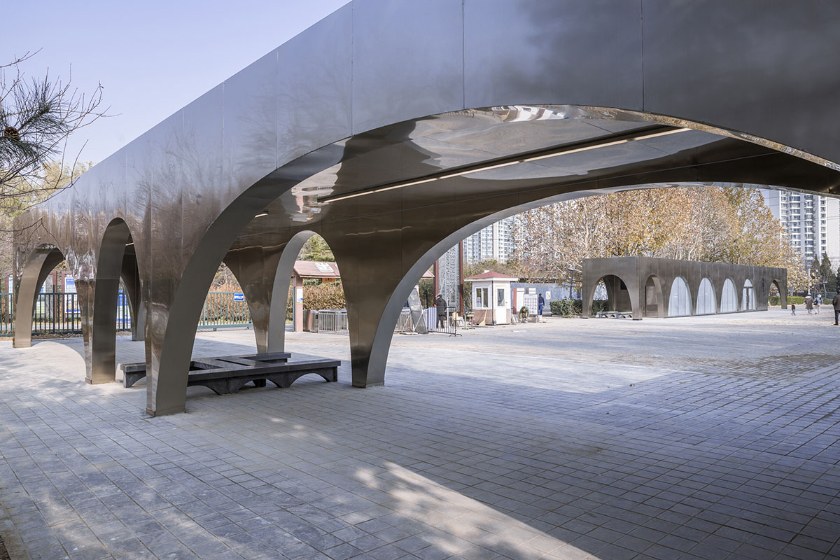 TEMP designs runner's station with stainless steel arcades in Beijing Olympic Forest Park
