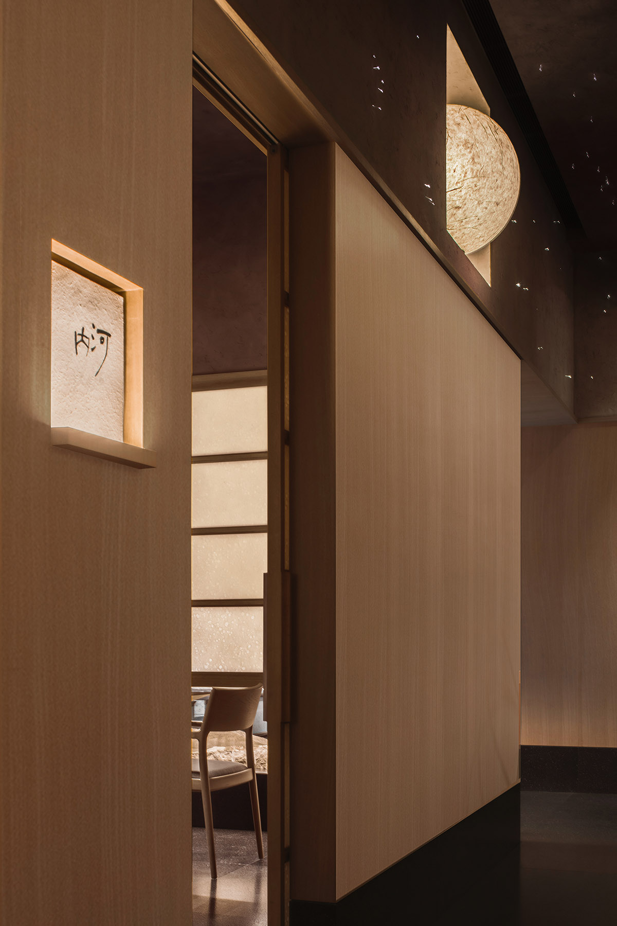 Nature Times Art Design creates tranquil dining space for Teng Restaurant in a sealed box form