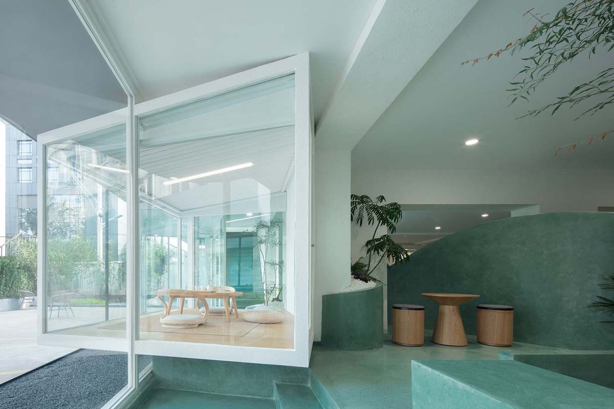 Jiejie Studio creates artificial landscape for bookstore and teahouse with misty pond in Beijing 