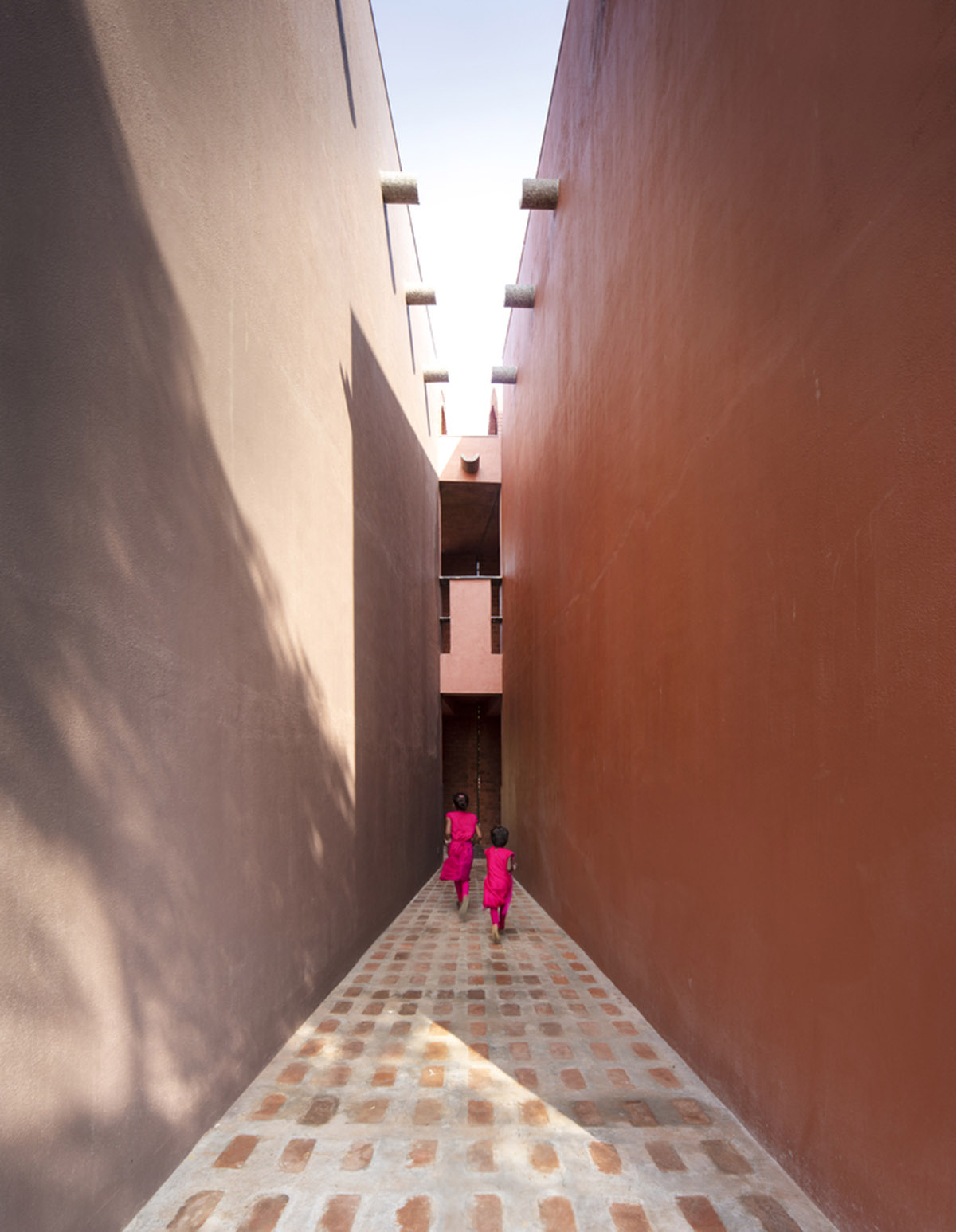 A school built from tilted brick vaults evoke a child's freedom in India
