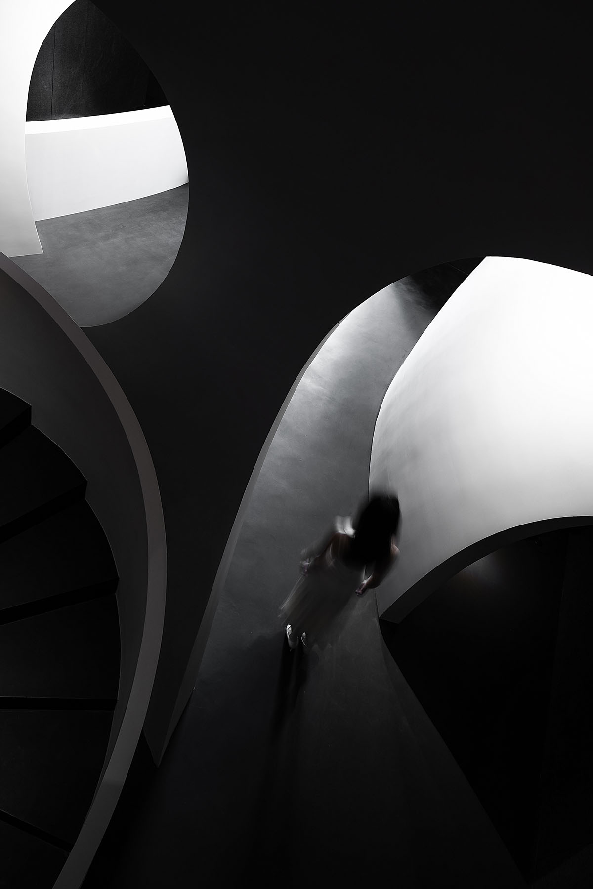 A beauty salon by AD ARCHITECTURE features dark-hued interiors drawing inspiration from cells