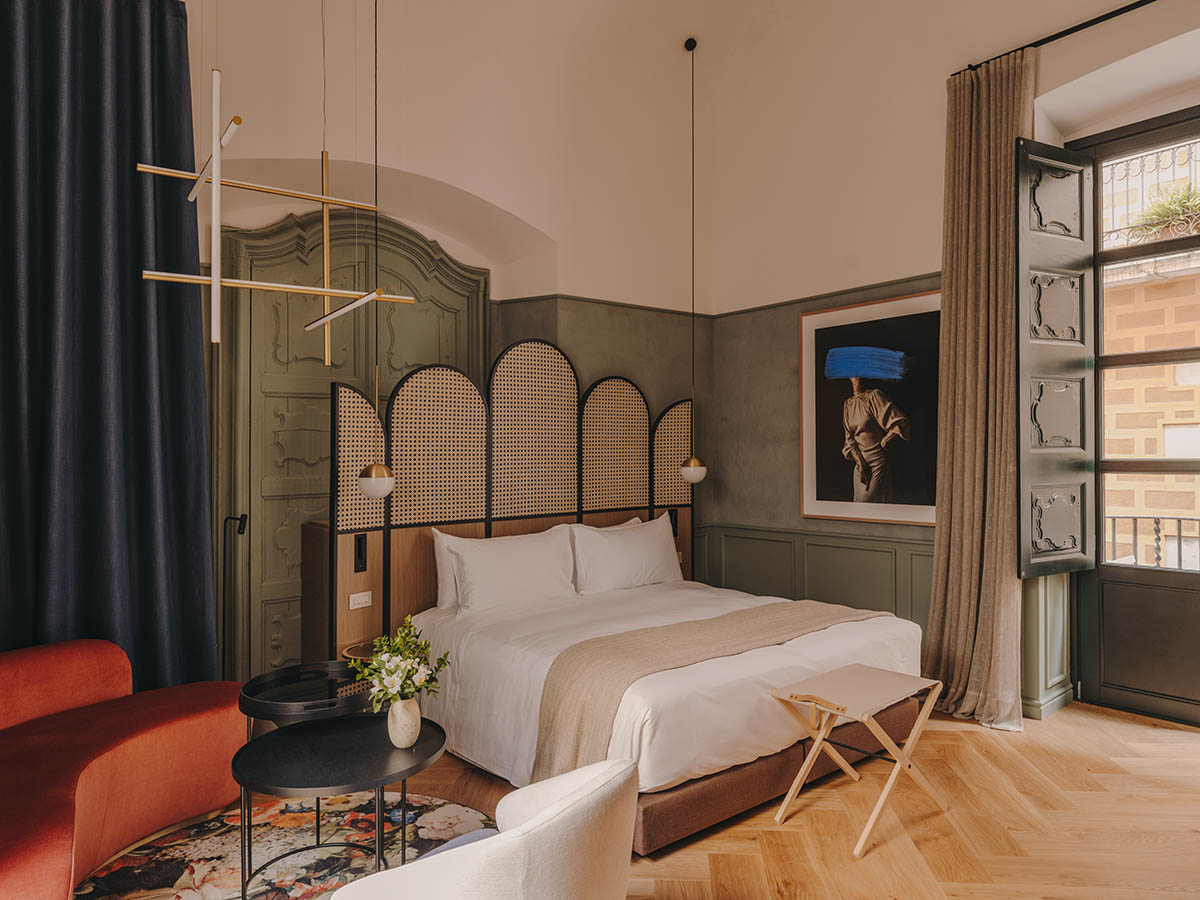 El Equipo Creativo converts 18th-century palace into hotel with rich textures and colors in Girona